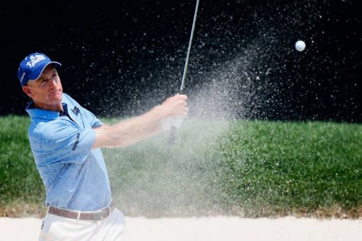 Jim Furyk plays a shot from the sand trap on the 18th hole during the second round of the World Golf Championships-Bridgestone Invitational on August 3. Furyk reached 11-under 129 and has a two-shot lead over Spain's Rafael Cabrera-Bello