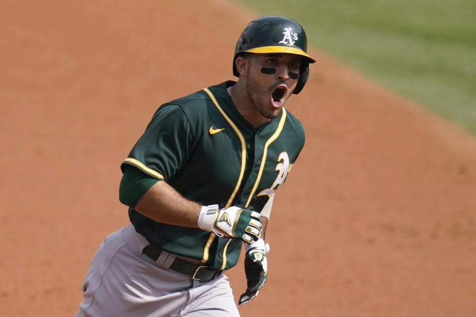 Oakland Athletics' Ramon Laureano reacts as he rounds the bases on his three-run home run against the Houston Astros during the second inning of Game 4 of a baseball American League Division Series in Los Angeles, Thursday, Oct. 8, 2020. (AP Photo/Marcio Jose Sanchez)