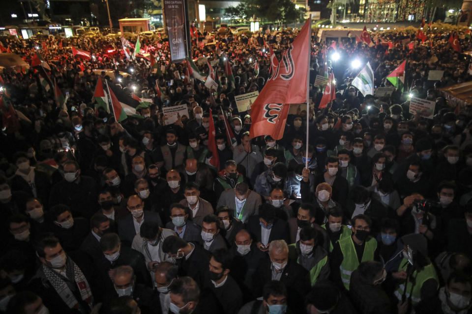 Protesters from IHH, a Turkish pro-Islamic organization hold a rally outside Israel's consulate in Istanbul, late Sunday, May 9, 2021, in support of Palestinians. Dozens of Palestinians were wounded in violent confrontations with police in Jerusalem overnight from Saturday to Sunday, when Muslims marked Laylat al-Qadr, or the "night of destiny," the holiest period of the Muslim fasting month of Ramadan. On Friday, more than 200 Palestinians were wounded in clashes at the Al-Aqsa Mosque compound and elsewhere in Jerusalem, drawing condemnations from Israel's Arab allies and calls for calm from the United States, Europe and the United Nations. (AP Photo/Emrah Gurel)