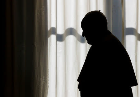 Pope Francis is silhouetted at the end of a private audience with President of Sierra Leone Ernest Bai Koroma at the Vatican, November 11, 2017. REUTERS/Tony Gentile