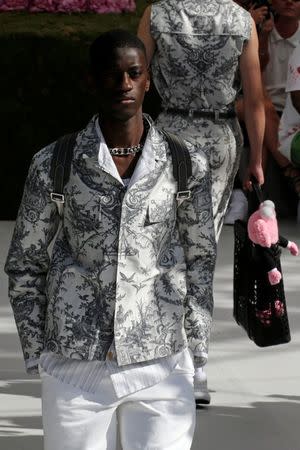 A model presents a creation by designer Kim Jones for Dior Homme collection as part of their Spring/Summer 2019 collection show during Men's Fashion Week in Paris, France, June 23, 2018. REUTERS/Pascal Rossignol