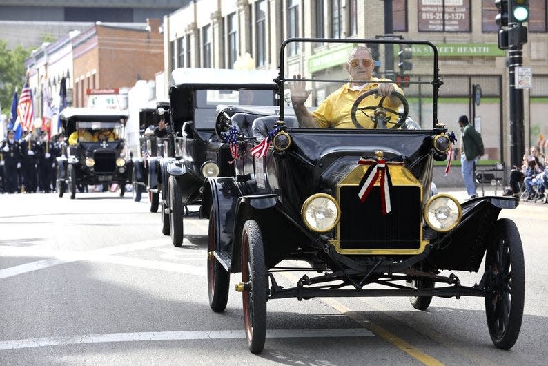 Antique cars stroll down State Street Monday, May 31, 2021, during the Memorial Day Parade in downtown Rockford.