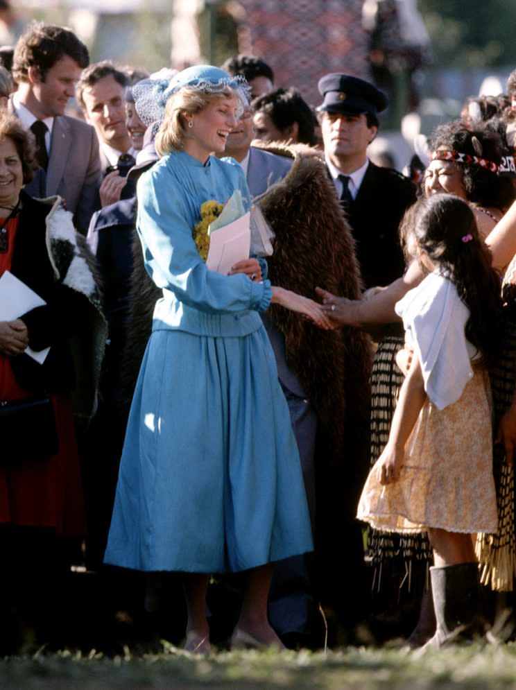 Diana is pictured in turquoise silk skirt-suit. (Photo by JOHN SHELLEY/REX/Shutterstock)