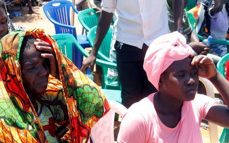 Relatives mourn as they attend the burial of dead passengers retrieved after the MV Nyerere ferry overturned off the shores of Ukara Island in Lake Victoria, Tanzania September 23, 2018. REUTERS/Stringer