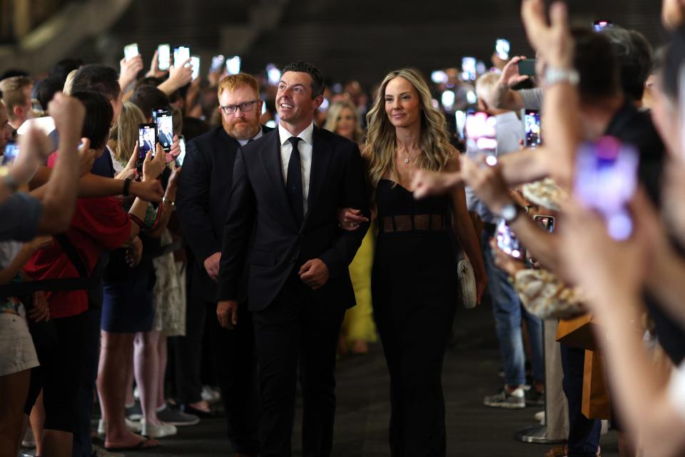 Rory McIlroy of Team Europe and wife Erica Stoll walk through fans at the Spanish Steps prior to the 2023 Ryder Cup at Marco Simone Golf Club on September 27, 2023 in Rome, Italy. (Photo by Richard Heathcote/Getty Images)