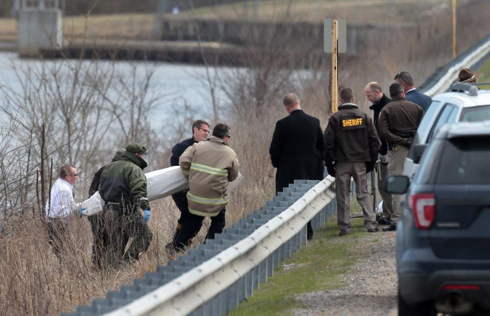 A body is recovered near Silver Lake in Highland, Ill., on Thursday, March 16, 2017, after a car with an infant was pulled from the lake earlier in the morning. (Laurie Skrivan/St. Louis Post-Dispatch via AP)