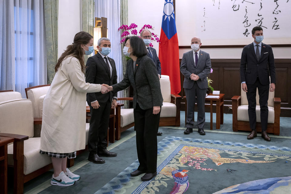 In this photo released by the Taiwan Presidential Office, Taiwan's President Tsai Ing-wen shakes hands with Leonore Porchet as she meets with visiting Swiss lawmakers in Taipei, Taiwan, Monday, Feb. 6, 2023. A group of Swiss lawmakers met with Taiwan's president and said Monday their government wants to deepen political relations, adding to shows of support by foreign politicians for the self-ruled island democracy in the face of Chinese intimidation. (Taiwan Presidential Office via AP)