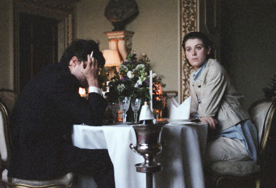 This image released by A24 films shows Tom Burke, left, and Honor Swinton Byrne in a scene from "The Souvenir," a film by Joanna Hogg. (A24 via AP)