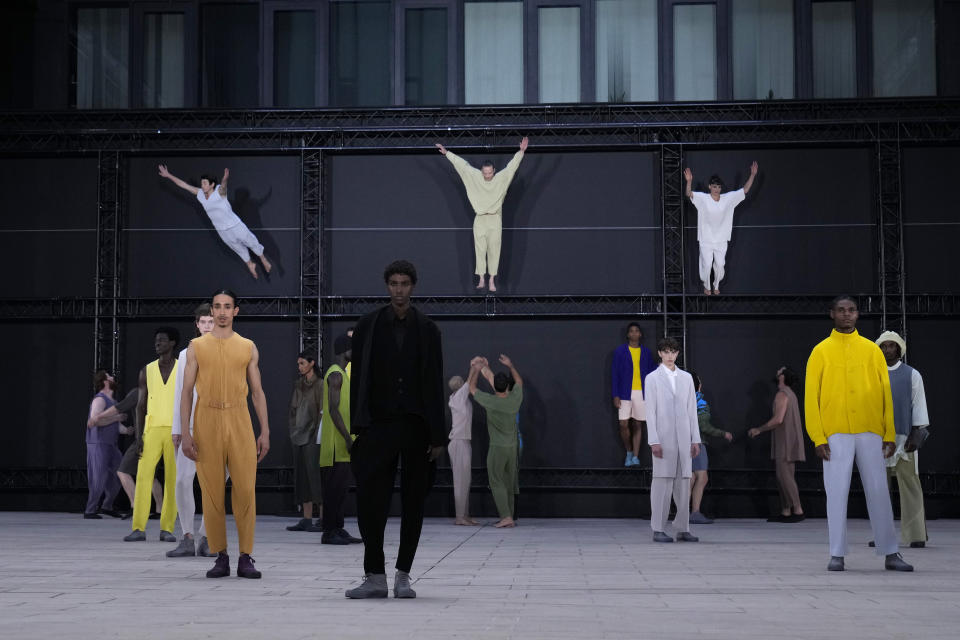 Models wear creations as part of Issey Miyake Homme Plisse men's Spring Summer 2023 collection presented in Paris, France, Thursday, June 23, 2022. (AP Photo/Francois Mori)