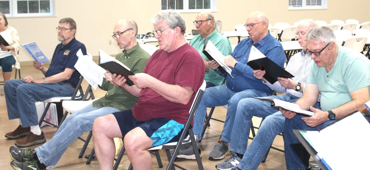 The tenor and bass sections of the Laurel Highlands Chorale sing deep for a number as they practice for the Laurel Highlands Chorale spring concert on Sunday and Monday.
