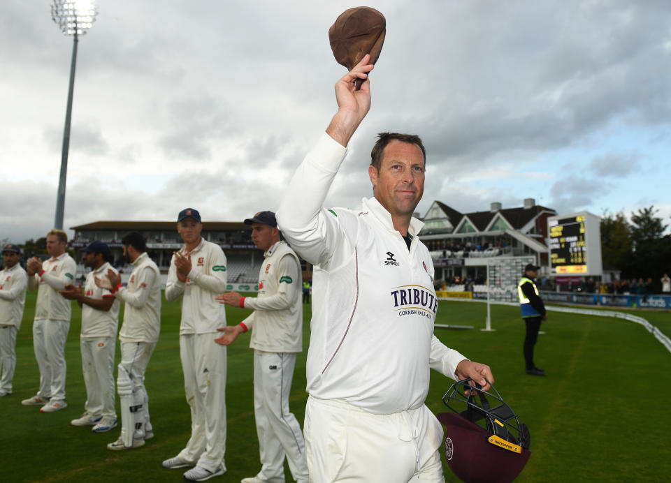 TAUNTON, ENGLAND - SEPTEMBER 26: Marcus Trescothick of Somerset raises his cap to the crowd as he is given a guard of honour on his final match before retiring during Day Four of the Specsavers County Championship Division One match between Somerset and Essex at The Cooper Associates County Ground on September 26, 2019 in Taunton, England. (Photo by Harry Trump/Getty Images)