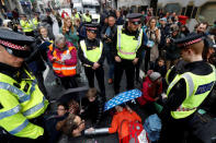 Police talks to demonstrators as they block traffic at Fleet Street during the Extinction Rebellion protest in London, Britain April 25, 2019. REUTERS/Peter Nicholls