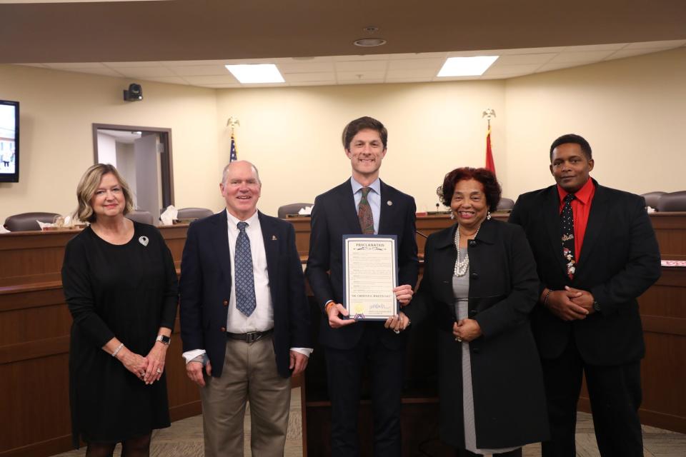 Mayor Chaz Molder, center, joins members of Columbia City Council in presenting outgoing Vice Mayor Christa Martin with a commemorative plaque for her 30 years of public service.