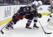 Columbus Blue Jackets' Mark Letestu, left, keeps the puck away from Pittsburgh Penguins' Olli Maatta, of Finland, during the second period of Game 4 of a first-round NHL hockey playoff series on Wednesday, April 23, 2014, in Columbus, Ohio. (AP Photo/Jay LaPrete)