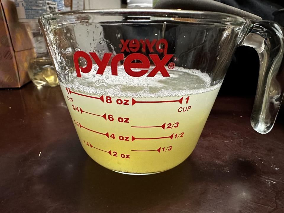 Light yellow liquid in a measuring cup