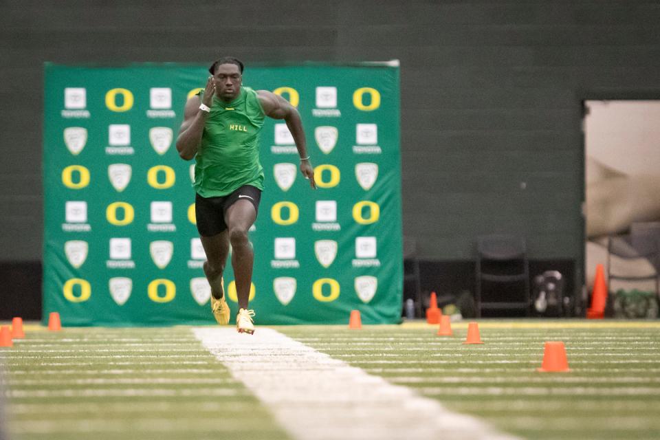 Oregon inside linebacker Jamal Hill participates in the 40-yard dash during Oregon Pro Day Tuesday, March 12, 2024 at the Moshofsky Center in Eugene, Ore.