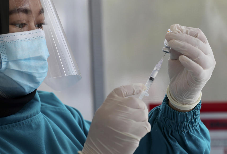 A doctor gives a dose for a shot of Covid-19 vaccine at a public health facility in Jakarta, Indonesia on Thursday. 