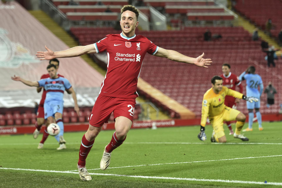 Liverpool's Diogo Jota celebrates after he scores his sides second goal during the English Premier League soccer match between Liverpool and West Ham United at Anfield stadium in Liverpool, England, Saturday, Oct. 31, 2020. (Peter Powell/Pool via AP)