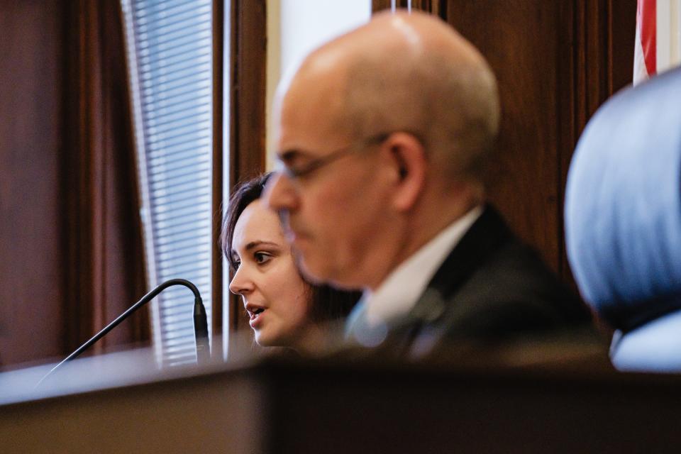 Nichole John, from Tuscarawas County Job & Family Services, answers questions from attorneys during a final pretrial hearing in the case against Justin D. McCauley before Judge Michael Ernest.