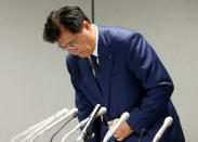 Mitsubishi Motors Corp's Chairman and Chief Executive Officer Osamu Masuko bows as he takes his seat at a news conference in Tokyo, Japan, August 30, 2016. REUTERS/Kim Kyung-Hoon