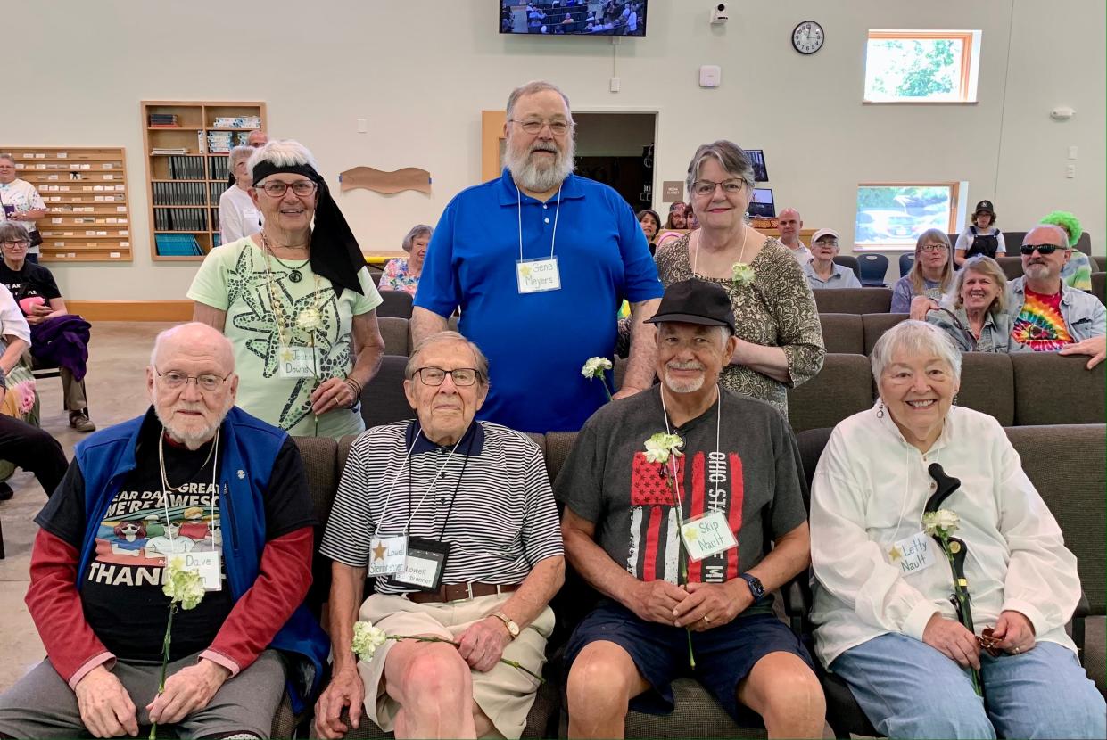 Attending the Unitarian Universalist Fellowship or Wayne County's anniversary celebration were founding members Dave Drumm (lower left), Lowell Steinbrenner, Letty Nault, Skip Nault, Joanne Downs (top left), Gene Meyers and Helen Meyers.