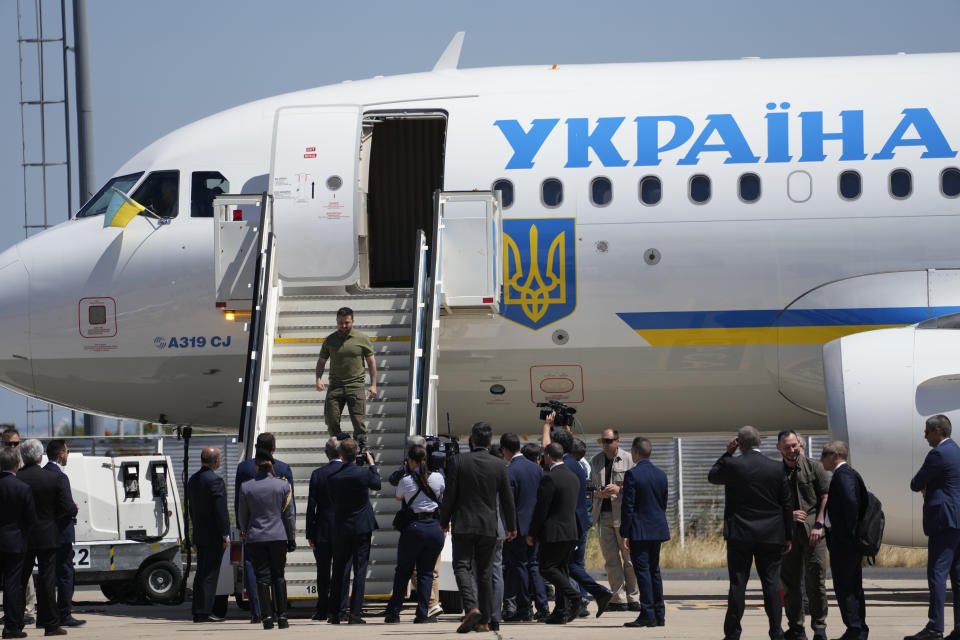 Ukrainian President Volodymyr Zelenskyy steps down from a plane on arrival at the military airport in Lisbon, Tuesday, May 28, 2024. (AP Photo/Armando Franca)