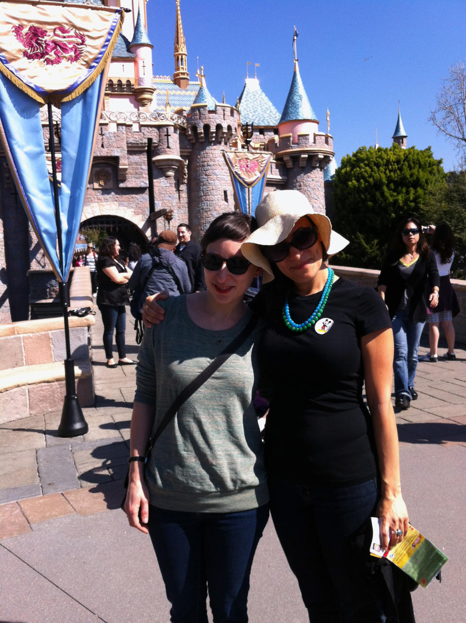 This March 2012 photo provided by Solvej Schou shows Schou, right, and her childhood friend, Joanna Sondheim, in front of Sleeping Beauty Castle at Disneyland in Anaheim, Calif. The two women, both in their 30s, regularly spent time at the park as kids and decided to go back as grown-ups to reconnect and rekindle fond memories. (AP Photo/Solvej Schou)