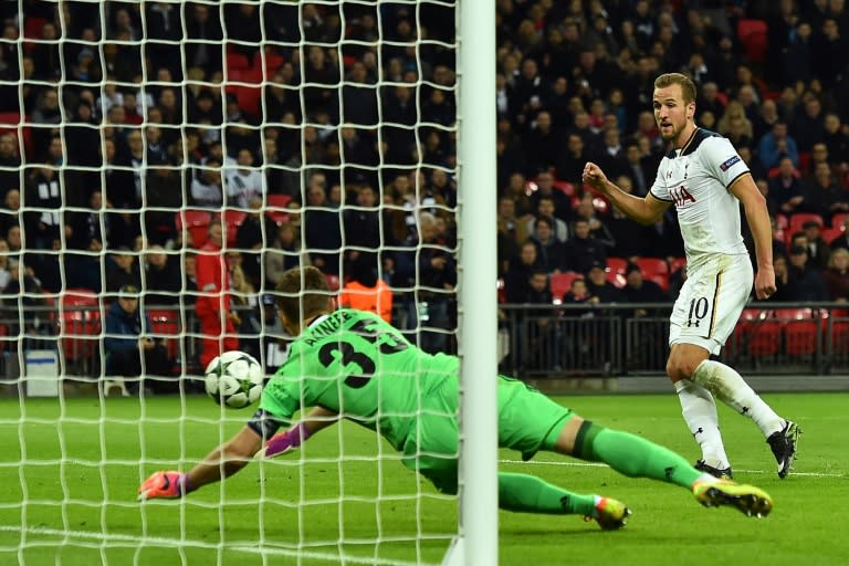 Tottenham Hotspur's striker Harry Kane (R) scores during the UEFA Champions League group E football match between Tottenham Hotspur and CSKA Moscow at Wembley Stadium in north London on December 7, 2016