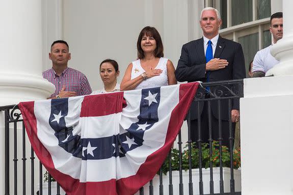 WASHINGTON, DC - JULY 4:  U.S. Vice President Mike Pence and his wife Karen Pence observe the playing of the national anthem before remarks from President Donald Trump on July 4, 2017, in Washington, DC. The president was hosting a picnic for military families  for the July 4 holiday.  (Photo by Zach Gibson/Getty Images)