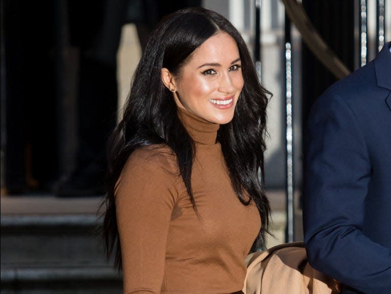 Meghan Markle in a toffee sweater.