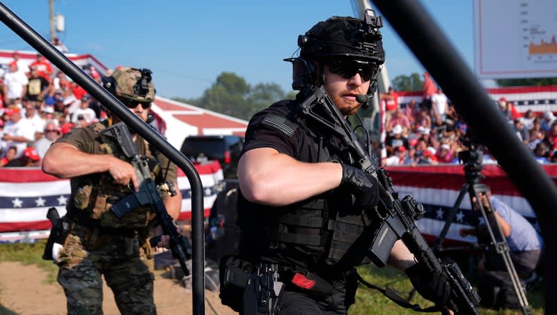 U.S. Secret Service agents surround the stage during a campaign rally with Republican presidential candidate and former President Donald Trump Saturday, July 13, 2024, in Butler, Pa.