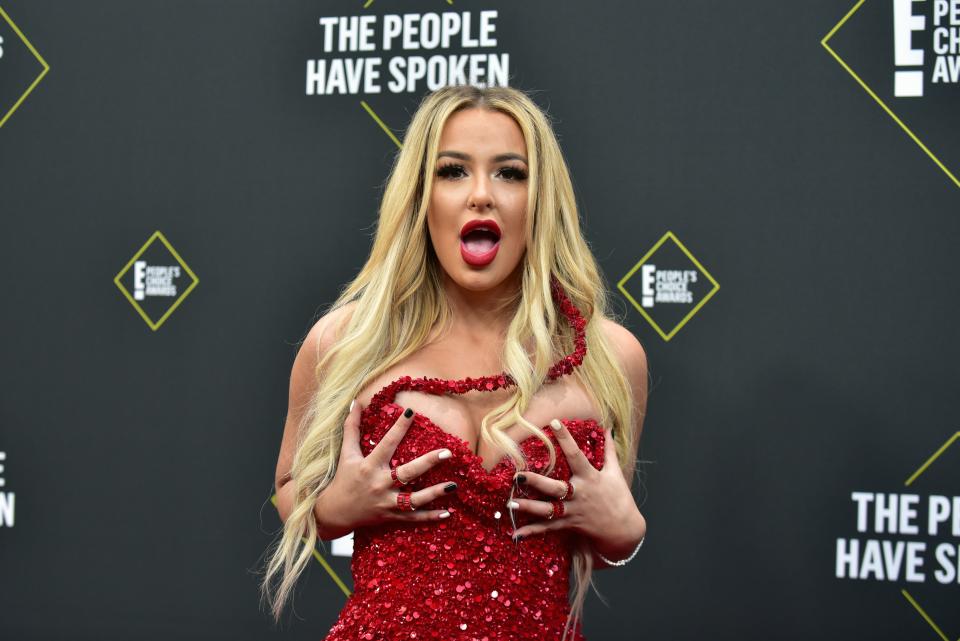 Tana Mongeau poses at an event