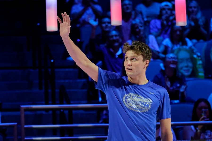 Bobby Finke at the medal ceremony after winning the men’s 800 freestyle during wave 2 of the U.S. Olympic Swim Trials on Thursday, June 17, 2021, in Omaha, Neb. (AP Photo/Charlie Neibergall)