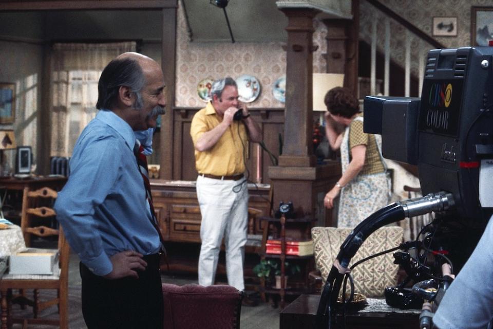 Norman Lear, Carroll O’Connor and Jean Stapleton on set of “All in the Family” in 1971. - Credit: ©CBS/Courtesy Everett Collection