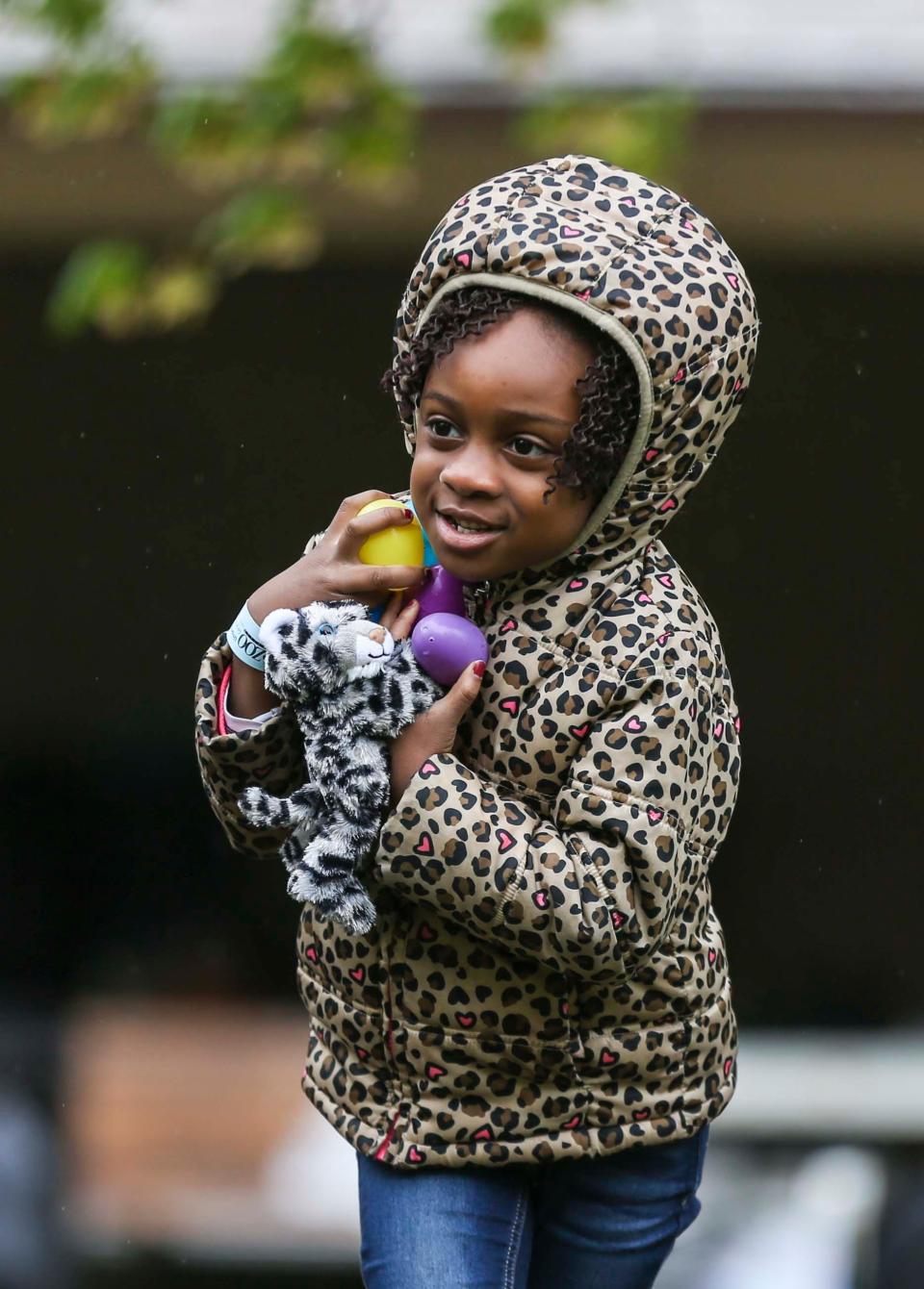 Believe Bukasa,6, held onto her eggs as she searches during an Easter egg hunt at the Louisville Zoo. April 20, 2019