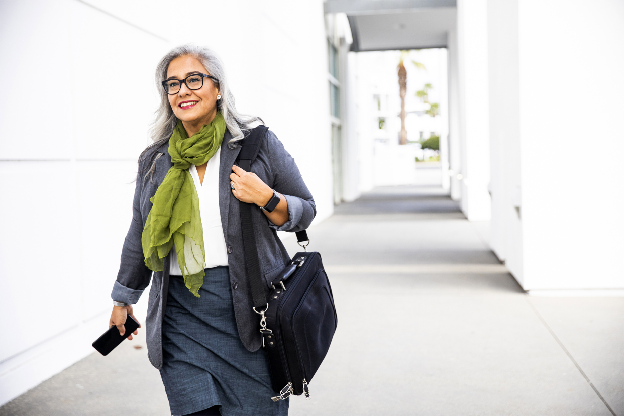 Senior woman leaving office