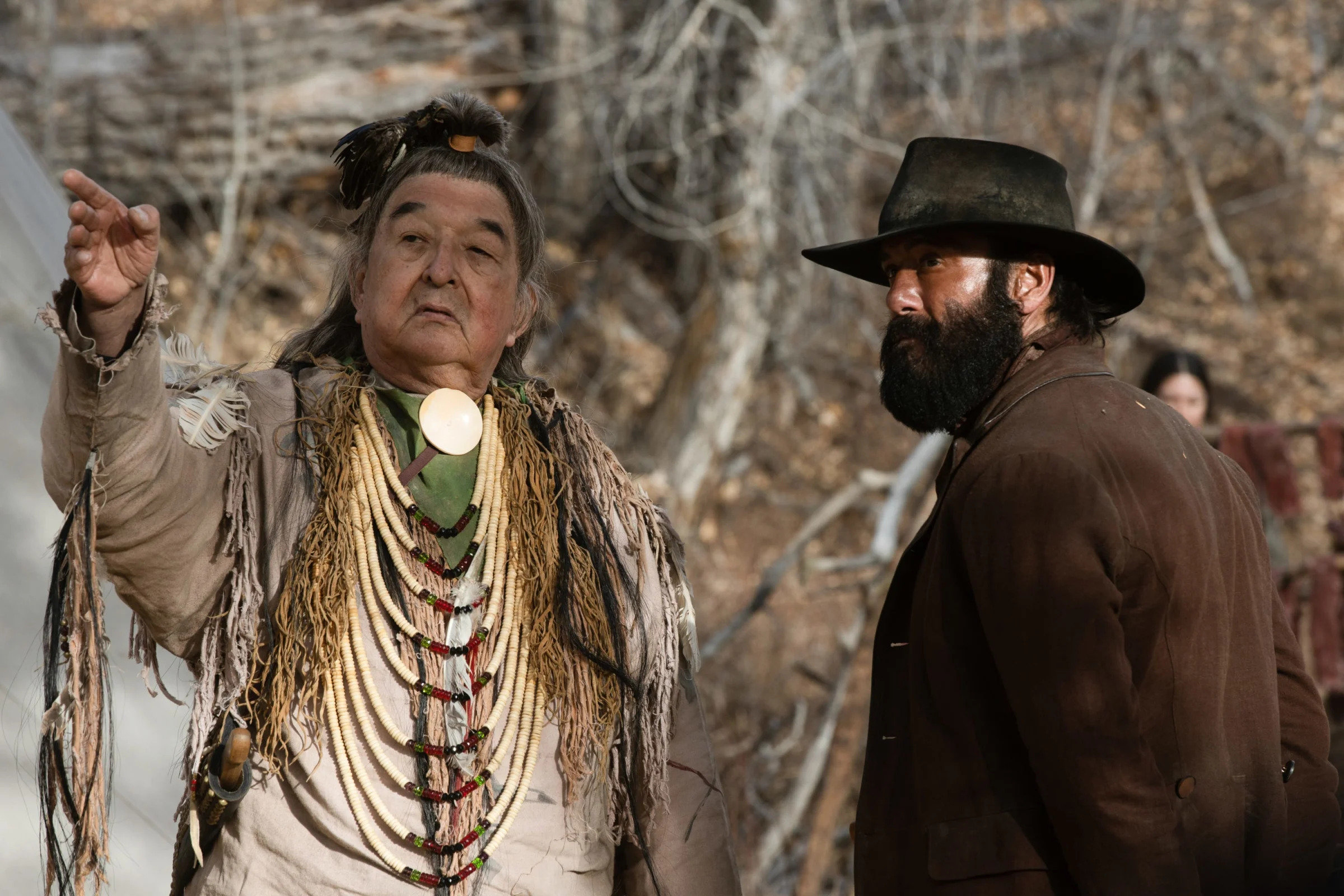 Graham Greene as Spotted Eagle and Tim McGraw as James Dutton in the Paramount+ original series "1883."