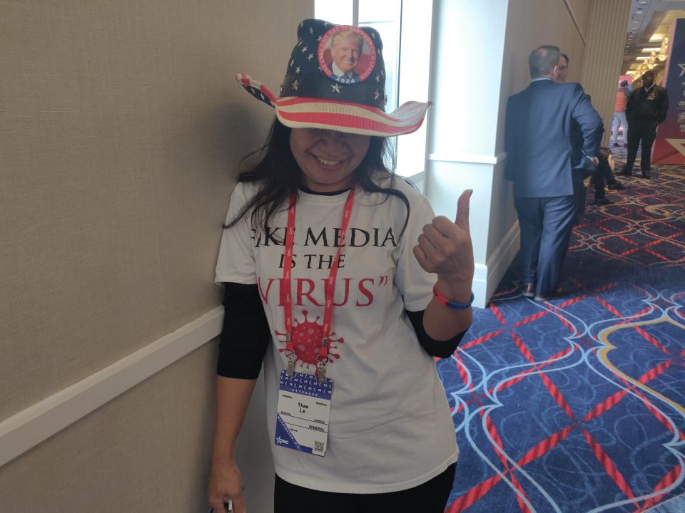 CPAC attendee Thao Le shows off the Donald Trump pin on her American flag-themed hat on Thursday, March 2, 2023.