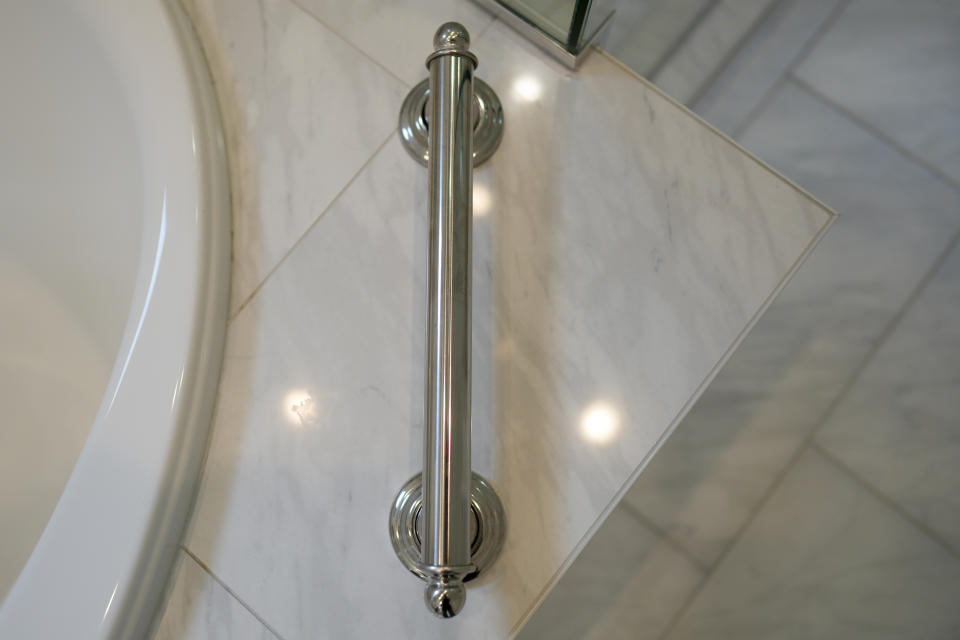 A grab bar next to the bathtub is shown in the recently remodeled home of Gene and Sallie Carr on Tuesday, May 7, 2024, in Hendersonville, N.C. An increasing number of Americans in their late 50s and older are staying in their houses, some by choice, others because they're locked into low mortgage rates that are too low to give up. (AP Photo/Chris Carlson)