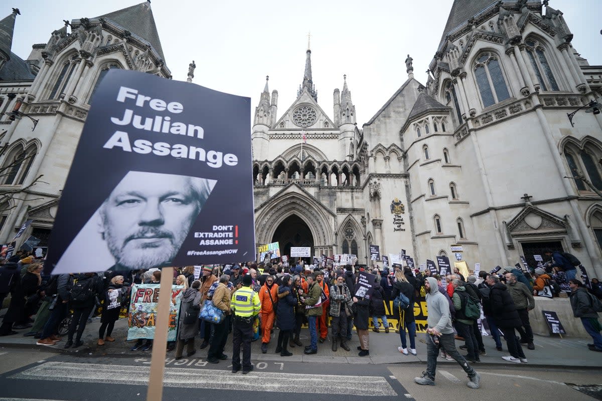 Supporters of Julian Assange gathered outside the Royal Courts of Justice in London (PA) (PA Wire)