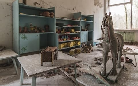 An abandoned children's bedroom, taken in Pripyat, Ukraine, April 2017. OVER 30 years after the nuclear disaster of Chernobyl, the city of Pripyat is exactly as it was the day it was evacuated - Credit: Andreas Jansen/Barcroft Media