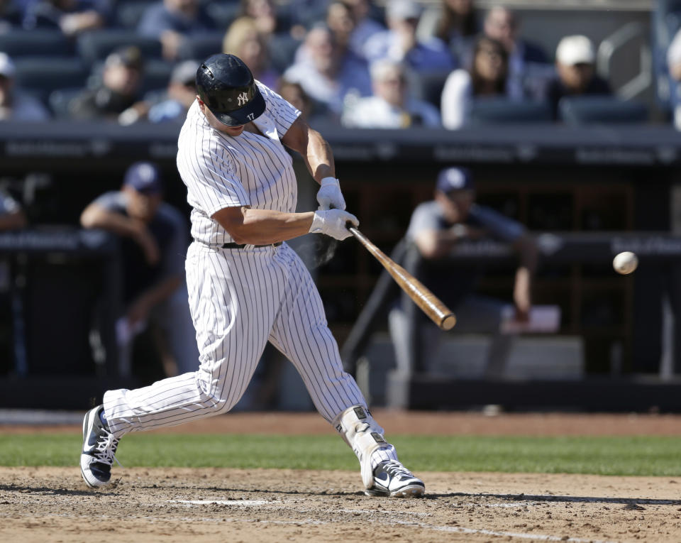 New York Yankees' Matt Holliday hits an RBI double during the eighth inning of the baseball game against the Tampa Bay Rays at Yankee Stadium, Monday, April 10, 2017, in New York. (AP Photo/Seth Wenig)