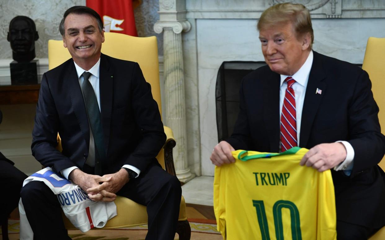 Mr Trump received a Brazilian football jersey - AFP