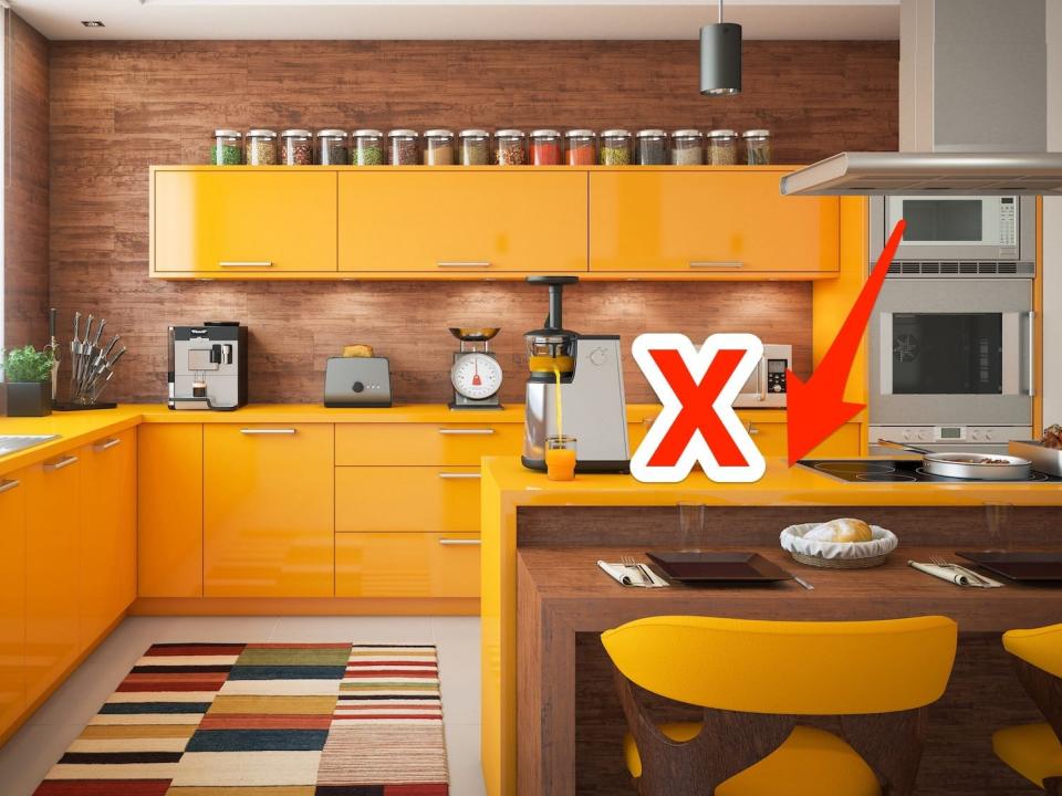 A kitchen with orange counters and cabinets.