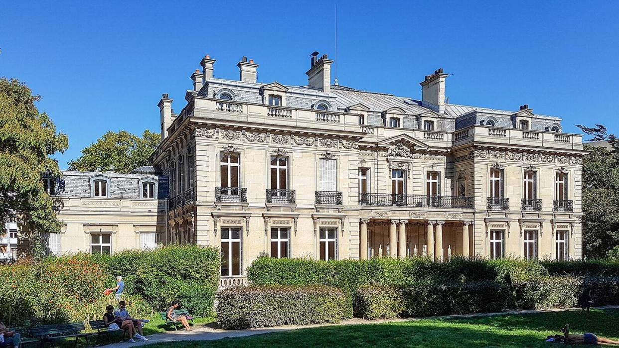 a large house with a lawn in front of it