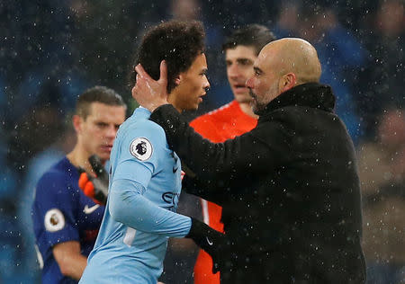 Soccer Football - Premier League - Manchester City vs Chelsea - Etihad Stadium, Manchester, Britain - March 4, 2018 Manchester City manager Pep Guardiola celebrates with Leroy Sane after the match REUTERS/Andrew Yates