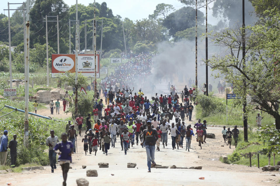 FILE - In this Monday, Jan. 14, 2019 file photo, protestors gather on the streets during demonstrations over the hike in fuel prices in Harare, Zimbabwe. 2019 is already a busy year for internet shutdowns in Africa, with governments ordering cutoffs as soon as a crisis appears. Zimbabwe ordered a “total internet shutdown” in recent days during protests over a dramatic fuel price increase and a resulting deadly crackdown. (AP Photo/Tsvangirayi Mukwazhi, File)