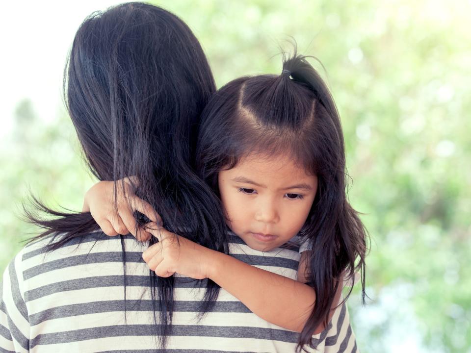 kid hugging mom