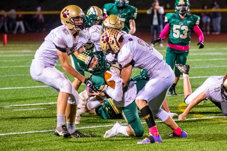 Old Colony's Matt McGuiggan makes a big open field tackle on GNB Voc-Tech's Jared Quann. McGuiggan finished with 72 tackles. 
(Photo: Ryan Feeney/Standard-Times File)