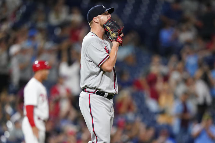 Atlanta Braves pitcher Will Smith reacts after giving up a two-run home run to Philadelphia Phillies' J.T. Realmuto during the ninth inning of a baseball game, Tuesday, July 26, 2022, in Philadelphia. (AP Photo/Matt Slocum)